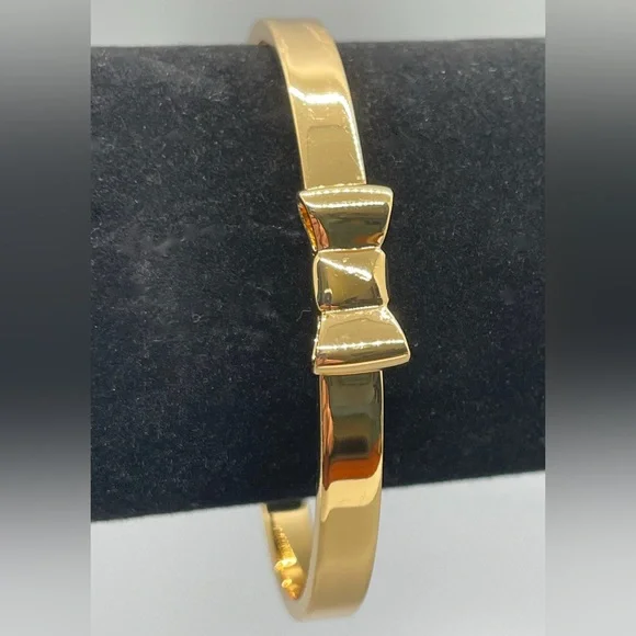 KATE SPADE TAKE A BOW GOLD TONE METAL BANGLE BRACELET Feminine Dressy Dainty - Picture 1 of 7